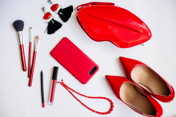 Red shoes, cosmetics and accessories. - Fotografie, Obrázek
