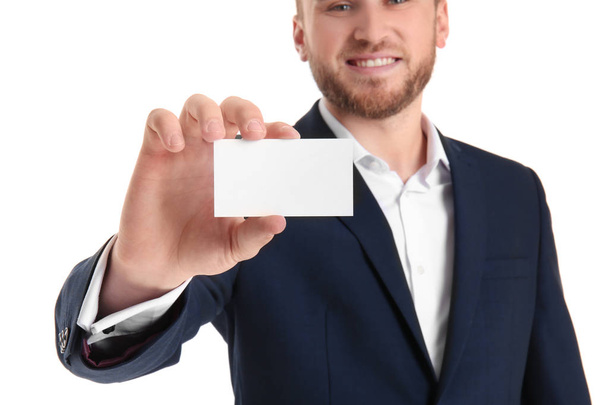 Man with business card on white background - Photo, Image