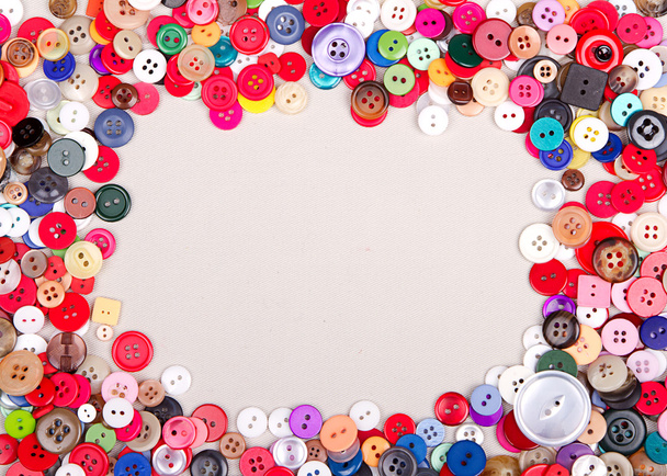 multi colored buttons on fabric - 写真・画像