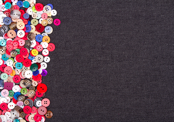 multi colored buttons on denim - Фото, зображення