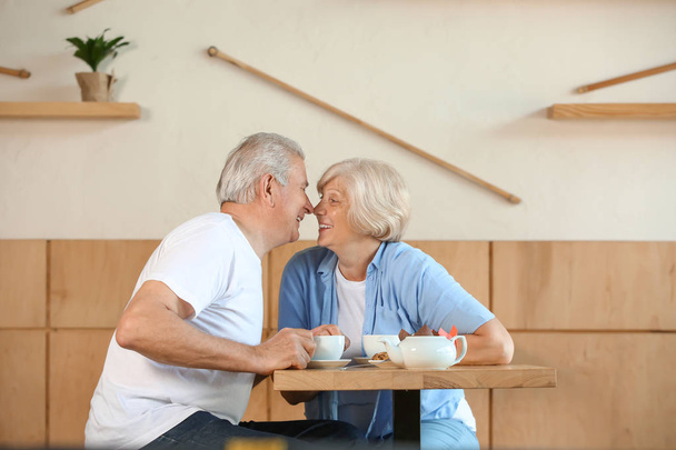 Happy senior couple sitting together in cafe - Fotografie, Obrázek