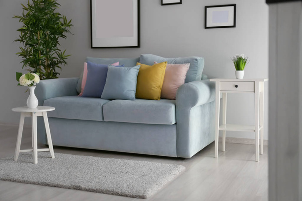 Stylish interior of living room with comfortable sofa - Fotoğraf, Görsel