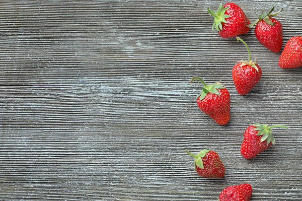 Ripe strawberries on wooden background - Photo, image
