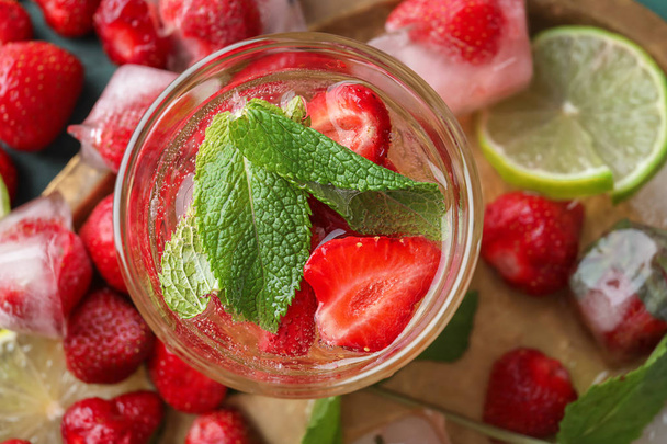 Glass with strawberry mojito on metal tray - Photo, Image