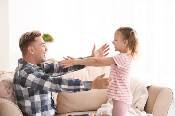 Happy father and daughter spending time together at home - Photo, image