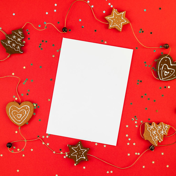 Creative New Year or Christmas greetings letter mockup flat lay top view Xmas holiday celebration envelope on red paper background golden glitter. Square Template mock up greeting card text 2019 2020 - Photo, Image