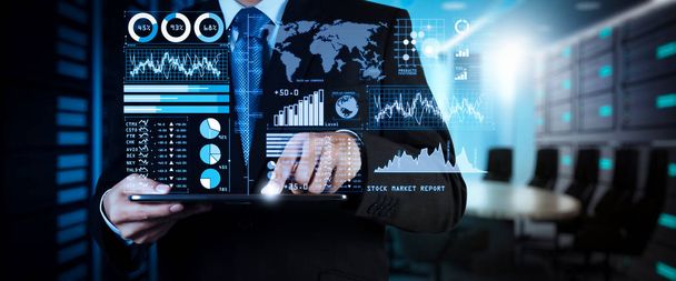 Investor analyzing stock market report and financial dashboard with business intelligence (BI), with key performance indicators (KPI).businessman hand working with finances program on wide screen computer. - Photo, Image