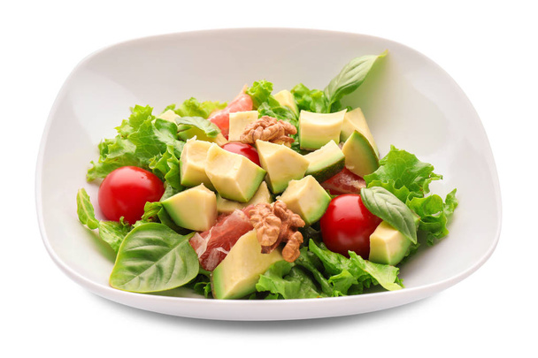 Тарелка с вкусным салатом из авокадо на белом фоне
 - Фото, изображение