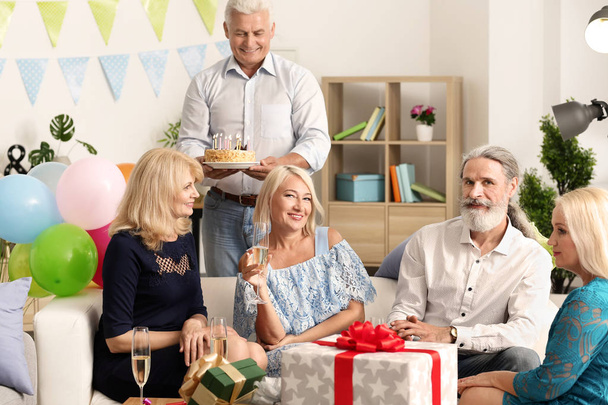 Mature people at birthday party at home - Photo, Image