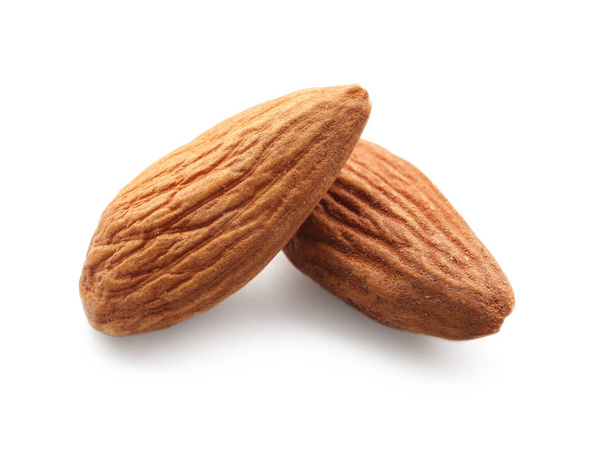 Tasty almonds on white background - Photo, Image