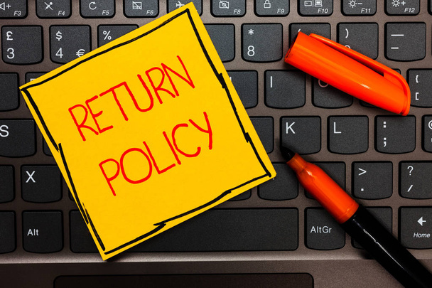Writing note showing Return Policy. Business photo showcasing Tax Reimbursement Retail Terms and Conditions on Purchase Yellow paper keyboard Inspiration communicate ideas orange markers. - Photo, Image