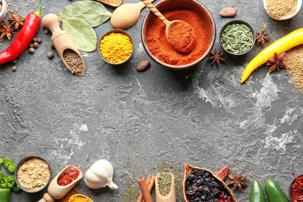 Composition with different dry spices on grunge background - Photo, Image