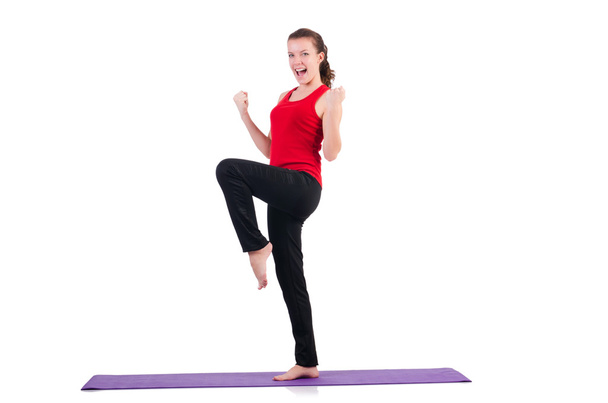 Молодая женщина делает упражнения на белом - Фото, изображение