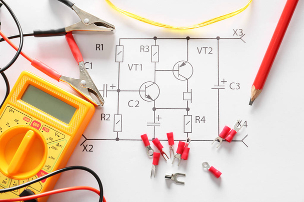Terminal ends with multimeter on electrical scheme - Photo, Image