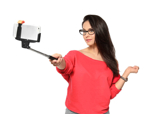 Attractive young women taking selfie on white background - Fotografie, Obrázek