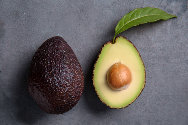 Ripe avocados on grey textured background - Photo, Image