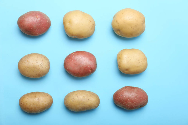 Flat lay composition with fresh organic potatoes on color background - Photo, Image