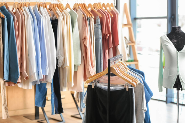 Racks with women clothes in modern store - Foto, Imagem