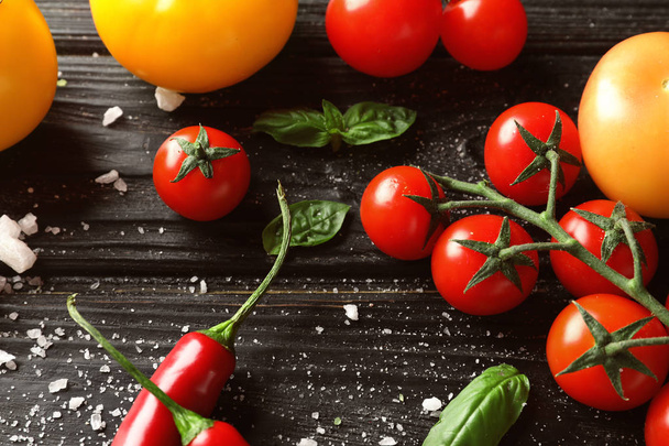 Fresh ripe cherry tomatoes and chili pepper on wooden background - Fotoğraf, Görsel