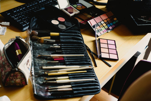 Cosmetics set, palette of eyeshadows, lipsticks, brushes, blush. - Foto, Bild