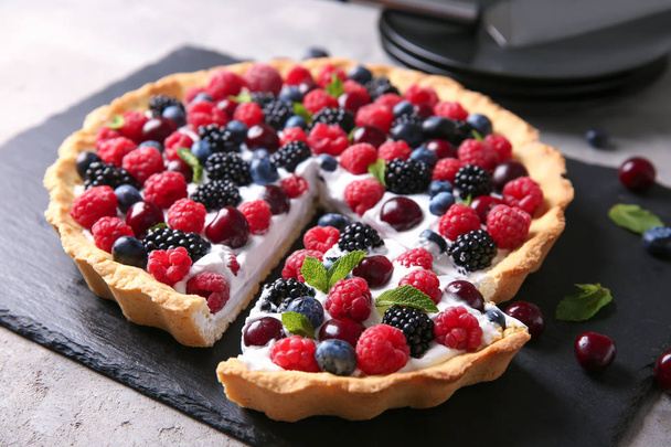 Slate plate with delicious berry pie on table - Fotografie, Obrázek