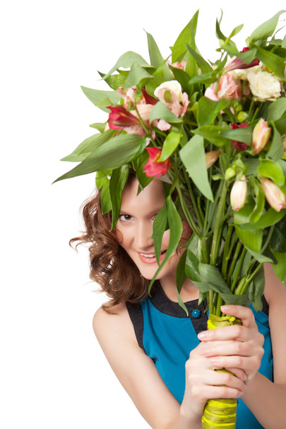 Portrait of pretty brunette holding bouquet of flowers - Foto, immagini