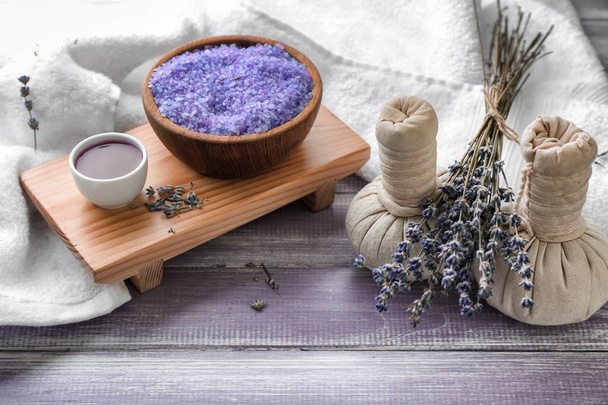 Spa composition with sea salt and lavender on wooden table - Φωτογραφία, εικόνα