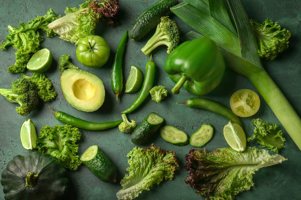 Various fresh vegetables for preparing salad on color background - 写真・画像