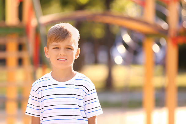 Portrait of cute little boy outdoors on sunny day - Фото, зображення