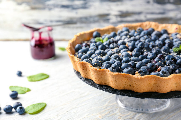 Dessert stand with delicious blueberry pie on table - Photo, Image