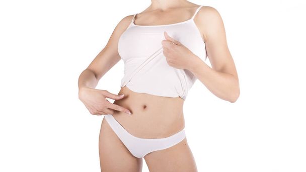 Il corpo di una donna magra abbronzata. isolato su sfondo bianco
 - Foto, immagini