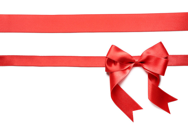 Red ribbons with bow on white background - Photo, Image