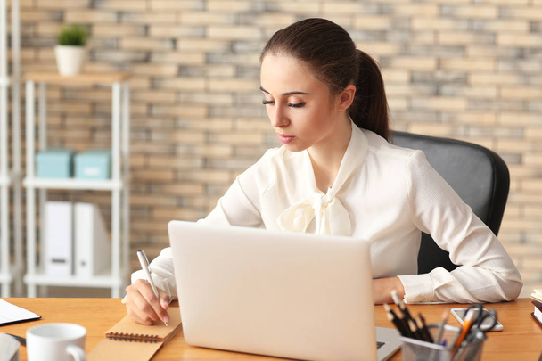 Young businesswoman working in office - Photo, Image