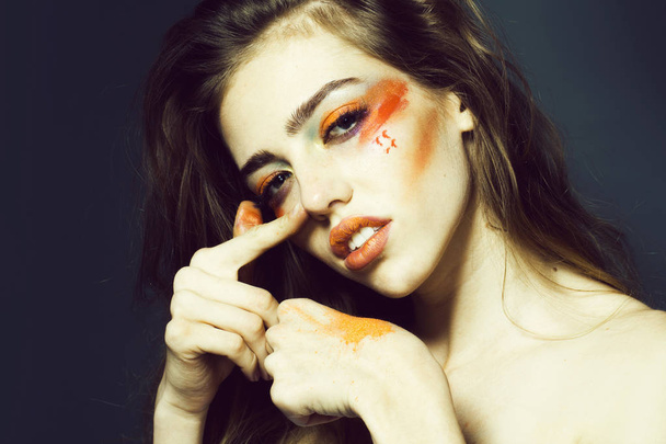 Girl with orange makeup closeup - Φωτογραφία, εικόνα