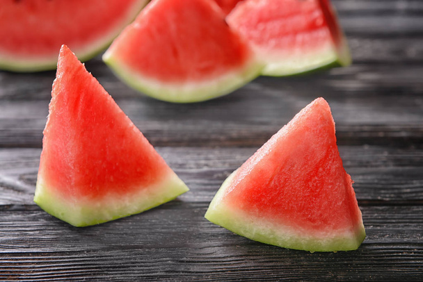Sweet watermelon slices on wooden background - Photo, image