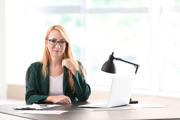 Stylish businesswoman working in office - Photo, Image