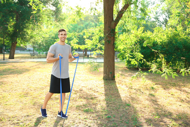 Sporty young man training outdoors - Photo, Image