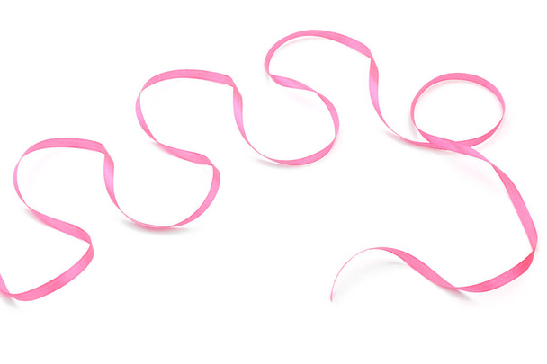 Curled pink ribbon on white background - Photo, Image