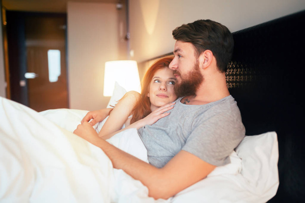 Sensual couple in bed cuddling - Valokuva, kuva
