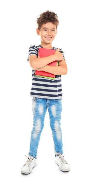 Cute little boy with books on white background - Foto, Imagen