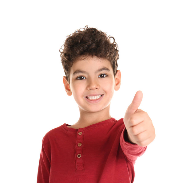 Cute little boy showing thumb-up gesture on white background - Zdjęcie, obraz