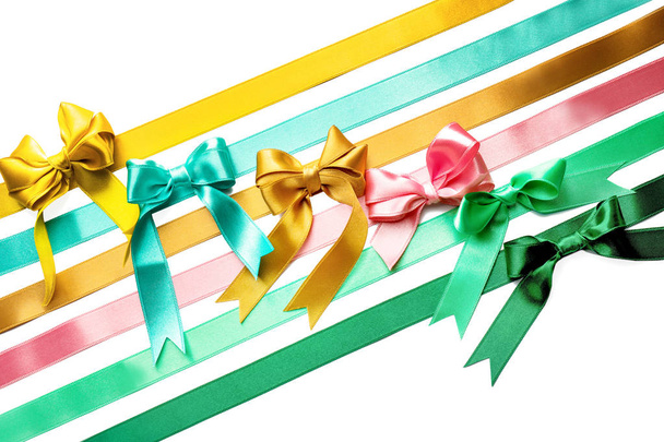 Color satin ribbons with bows on white background - Photo, Image