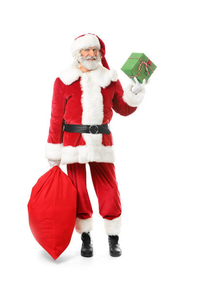 Portrait of Santa Claus with bag full of gifts on white background - Photo, Image