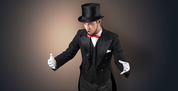 Magician holds something invisible  - Foto, imagen