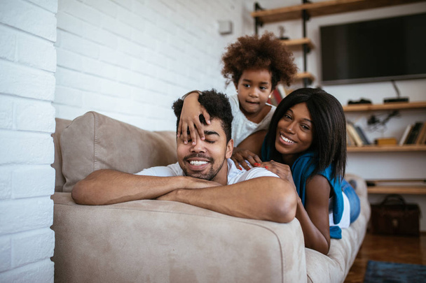 African american family enjoying spending time together at home. - Фото, изображение
