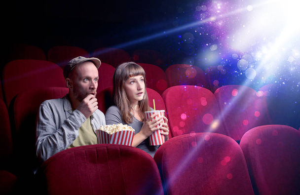 Romantic couple sitting at spectacle - Photo, Image
