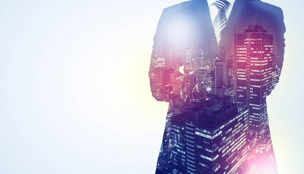 Businessman standing with night city graphic - Foto, Imagem