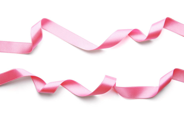 Розовые ленты на белом фоне - Фото, изображение