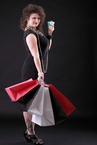 lovely woman with shopping bags - Фото, изображение