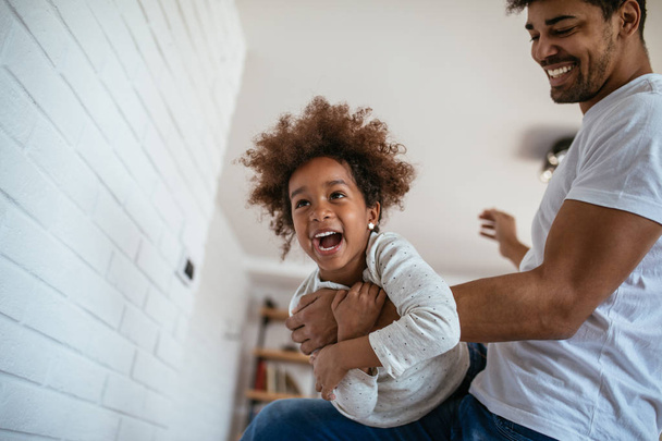 Shot of african american father and daughter having fun together at home. - Fotoğraf, Görsel